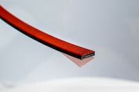 PROMASEAL®-LXP anthracite grey graphite-based seal, self-adhesive with a decorative surface in red